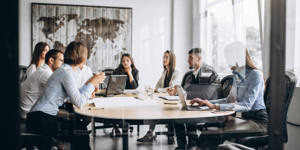 Group of people working out business plan in an office Group of people working out business plan in an office